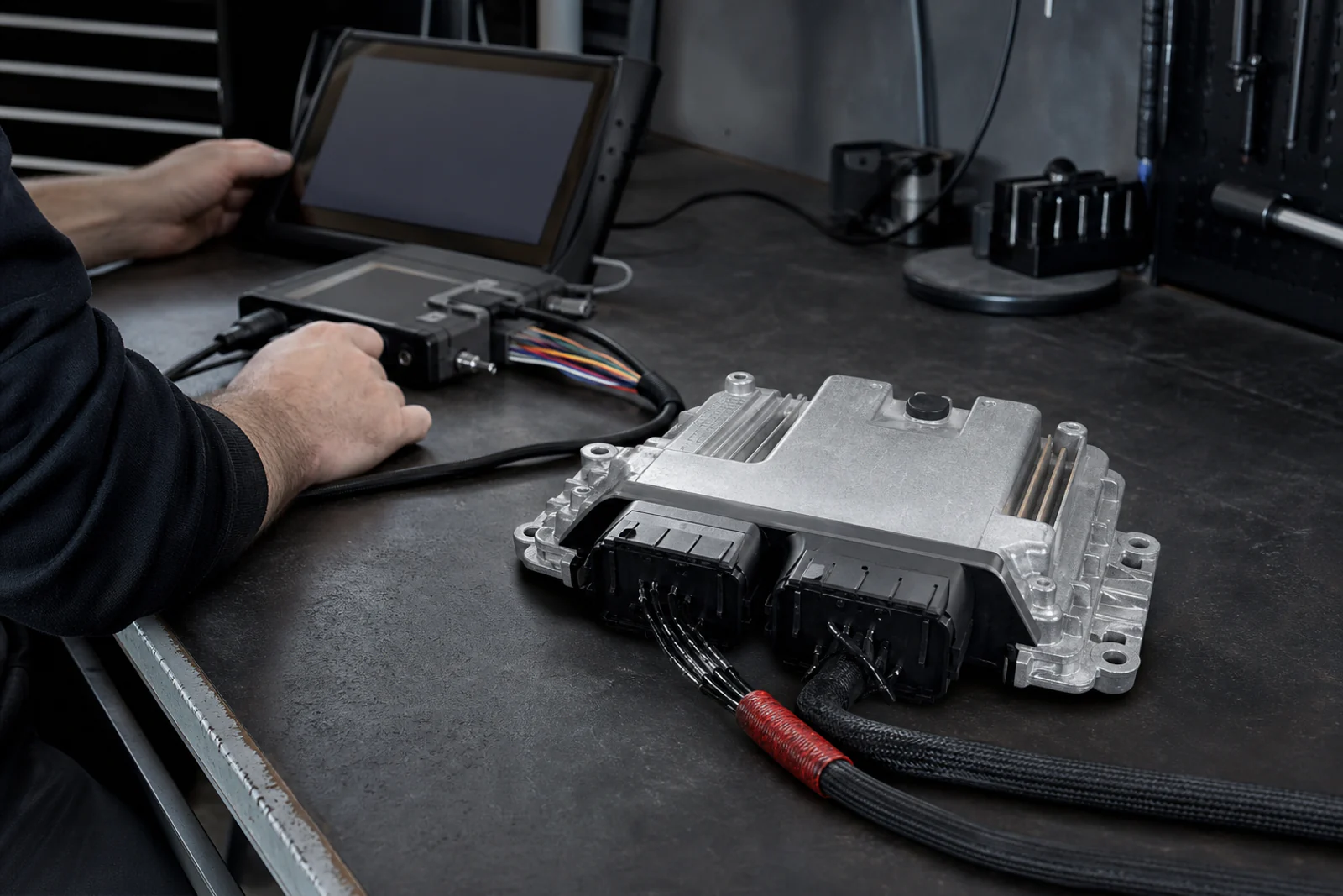 ECU connected to tuning hardware during a custom remap at Navs HID Direct